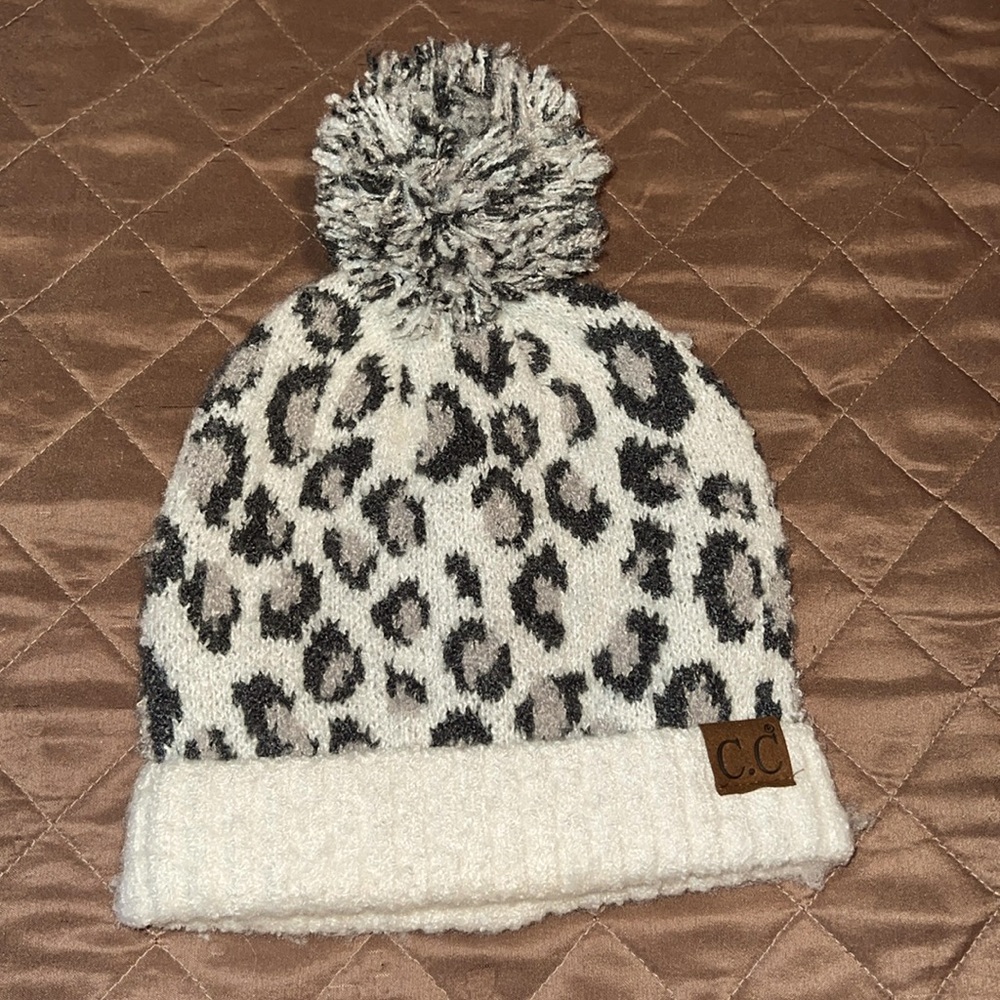 C.C knit beanie in grey and off-white leopard print with pom